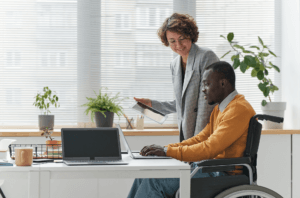 employee with disability working with manager