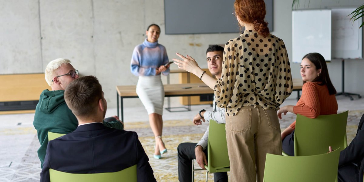 Female employee stands up and speaks out during workplace POSH Training