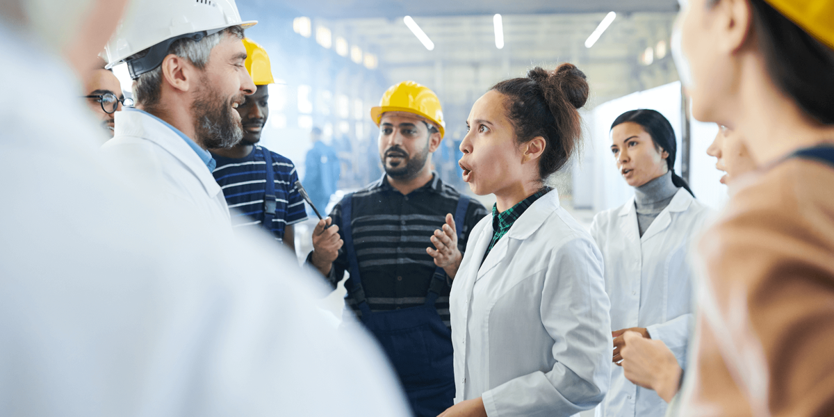 Angry female manager shouting at male employee