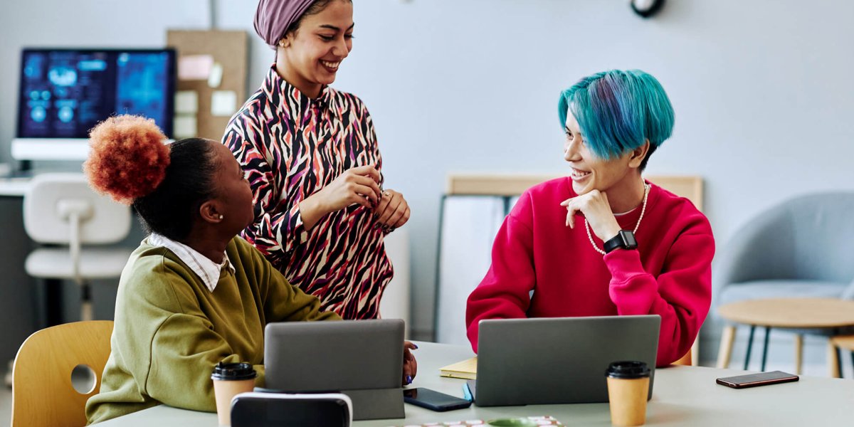 diverse team of creative young employees chatting about their recent diversity training