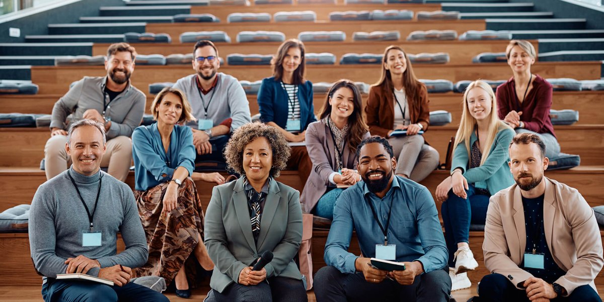 a large group of business people at diversity, equity, and inclusion training seminar
