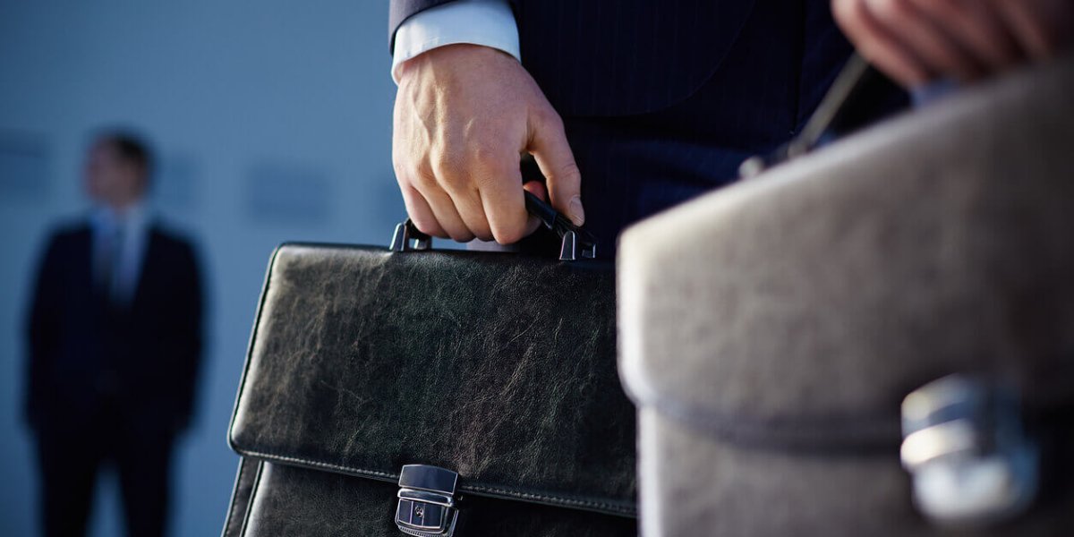 Businessmen Holding Briefcases