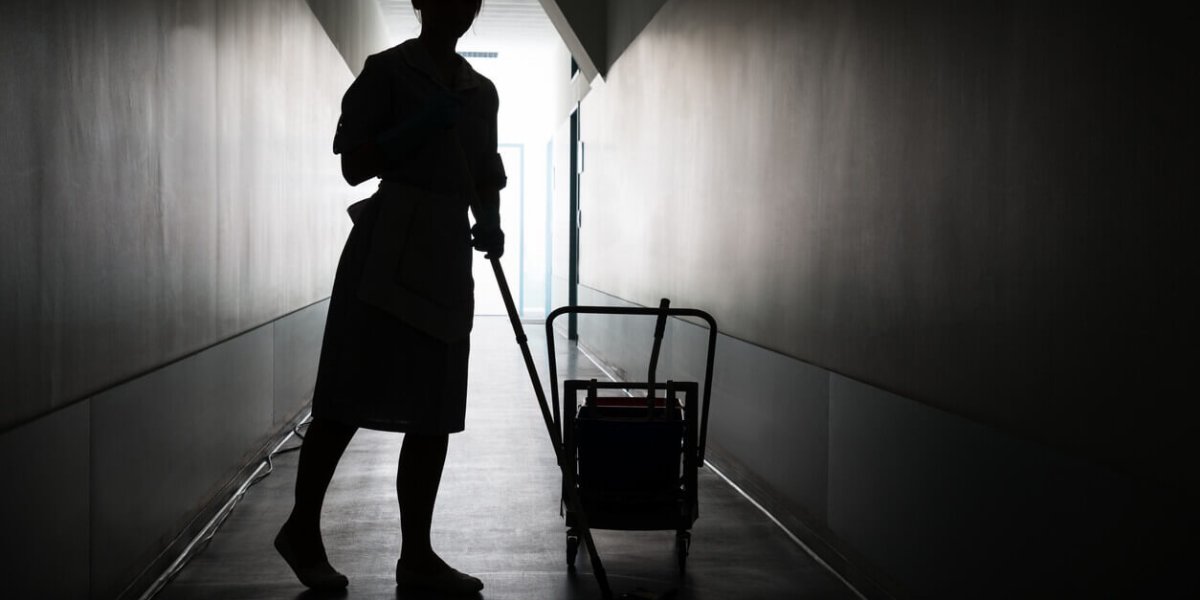 Silhouette Of Maid Cleaning Floor