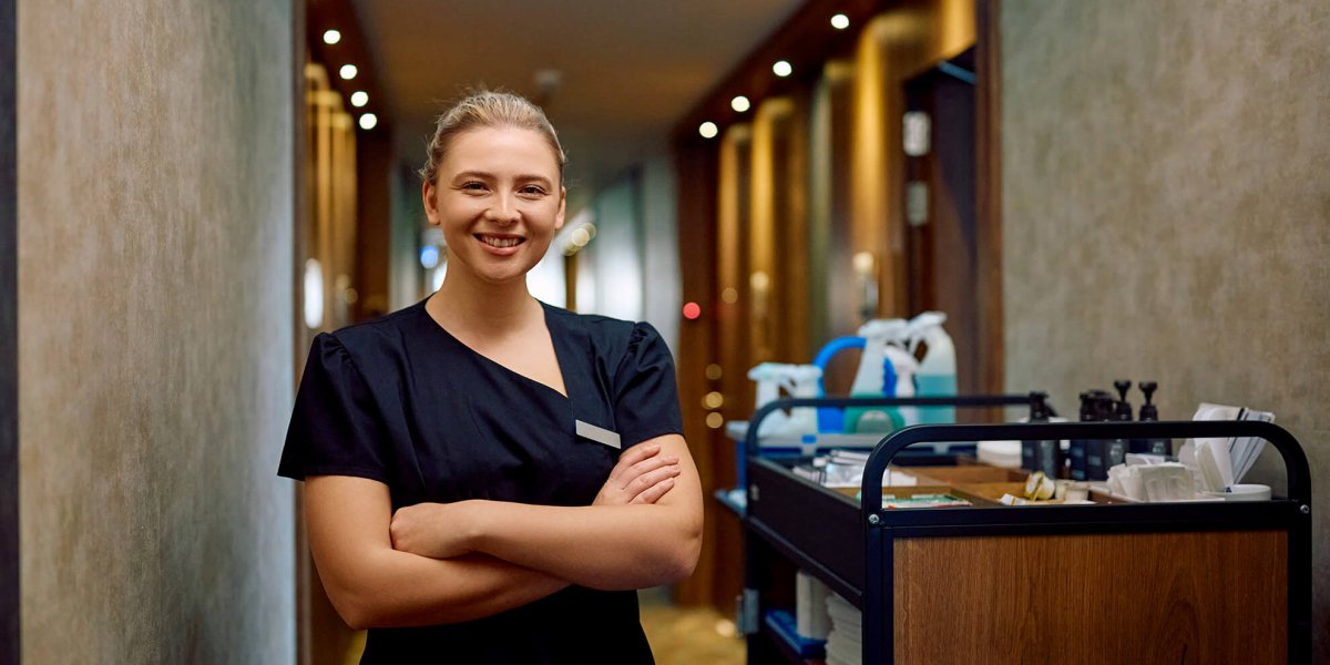 confident employee working in hotel after completing their justice for janitors training